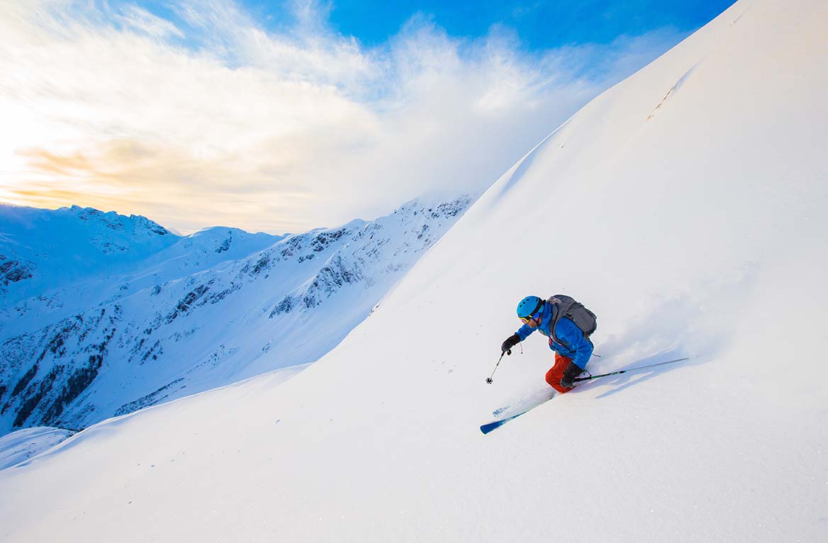 A young man skiing in the mountains near Terrace, British Columbia, Canada.
